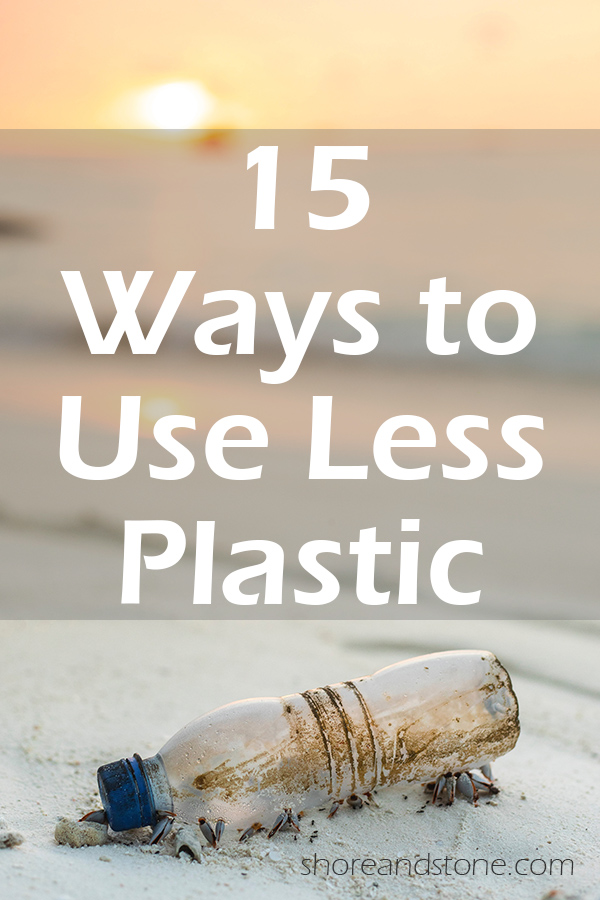 Plastic water bottle on a beach at sunset with text overlay "15 ways to use less plastic"